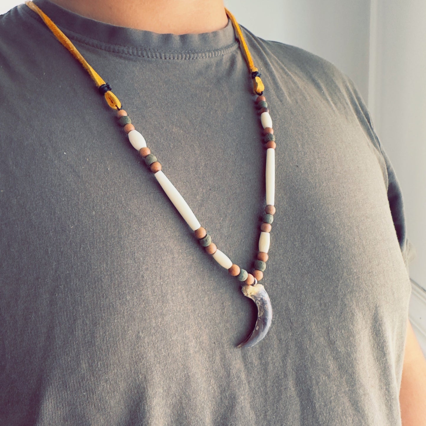 Handmade necklace inspired by wolf energy and traditional design