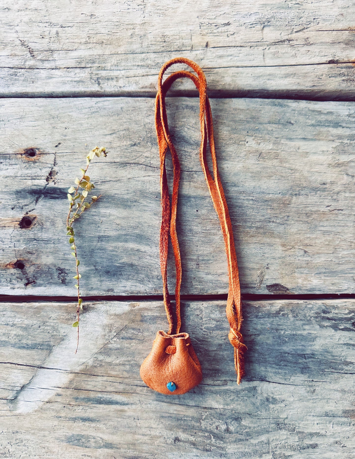 Small medicine bag made of moose leather with a gemstone