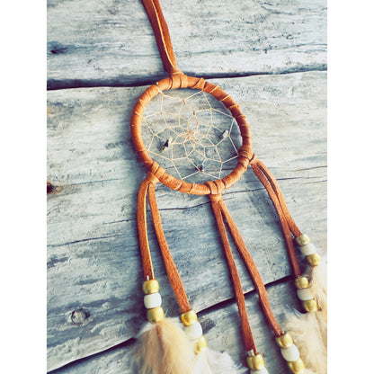 Authentic dreamcatcher decorated with real feathers and handcrafted details.
