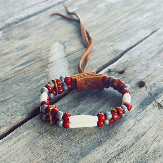 Handmade bone and earth tone glass bead bracelet with genuine moose leather, grounding Indigenous jewelry