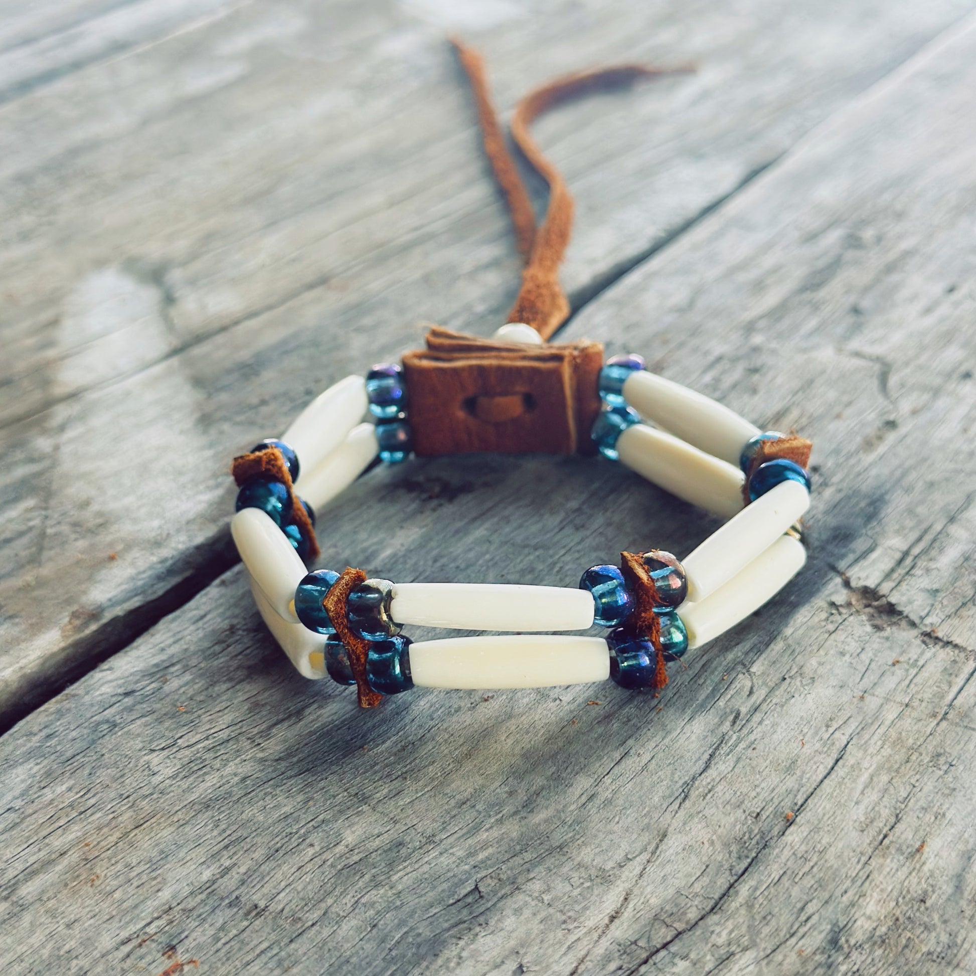 Handmade bone and iridescent blue glass bead bracelet with genuine moose leather, spiritual Indigenous bracelet
