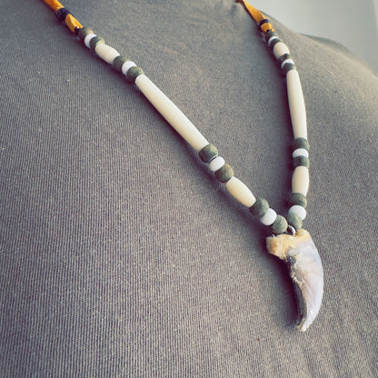 ecklace with bear-inspired pendant and natural earth tones