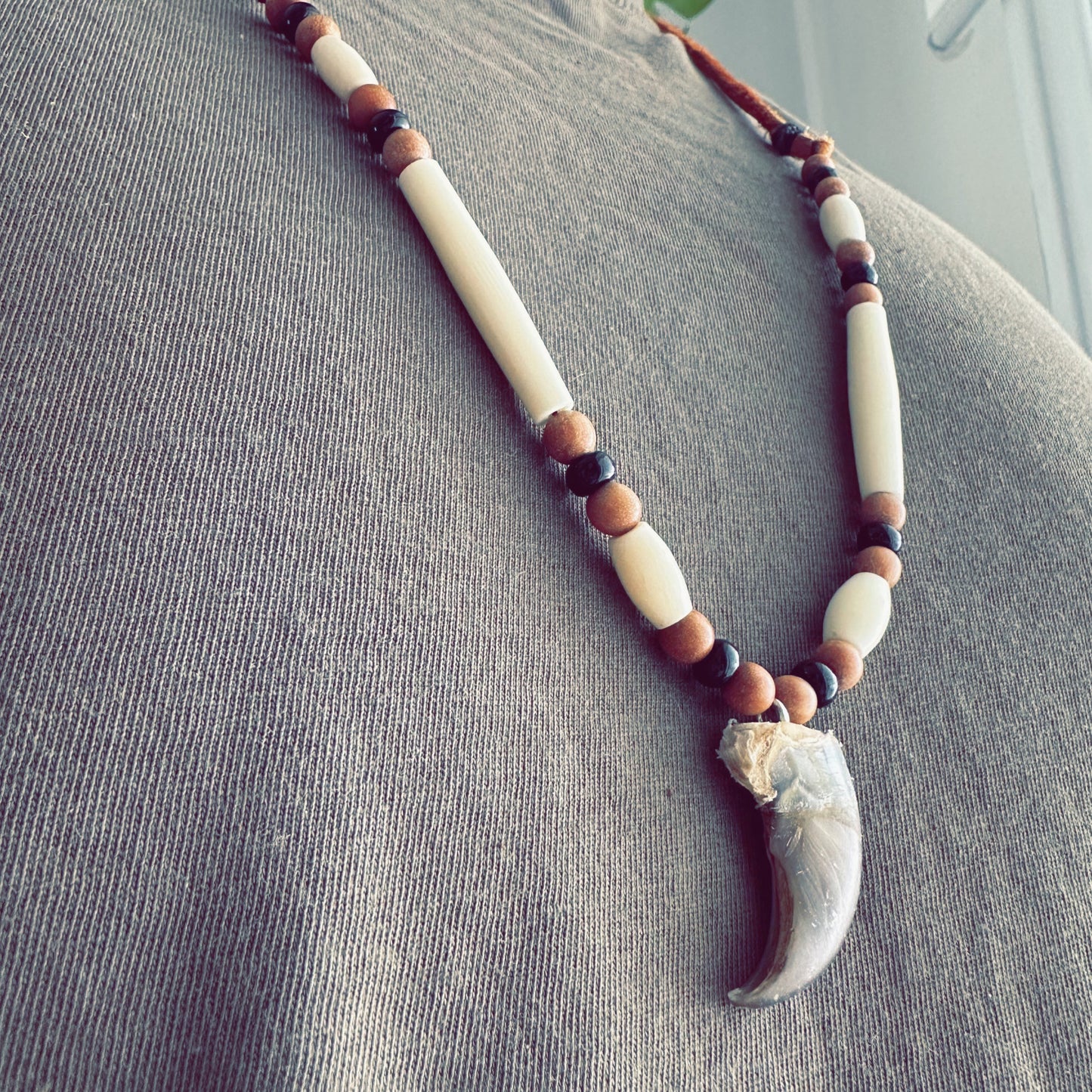 Bear-totem inspired necklace crafted with natural materials