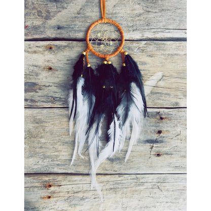 Artisan-made dreamcatcher crafted with natural materials and symbolic details.