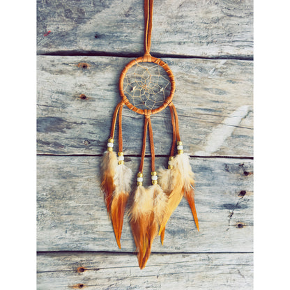 Handmade dreamcatcher with natural feathers and traditional Native craftsmanship.