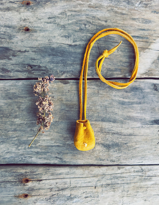 Handcrafted medicine pouch inspired by Indigenous traditions with leather