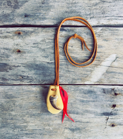 Handmade Indigenous medicine pouch in genuine moose leather with red ribbon accent