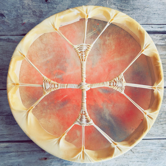 Handcrafted Indigenous drum made with natural deer hide, 14-inch diameter, shown from the back with wooden frame and rawhide lacing